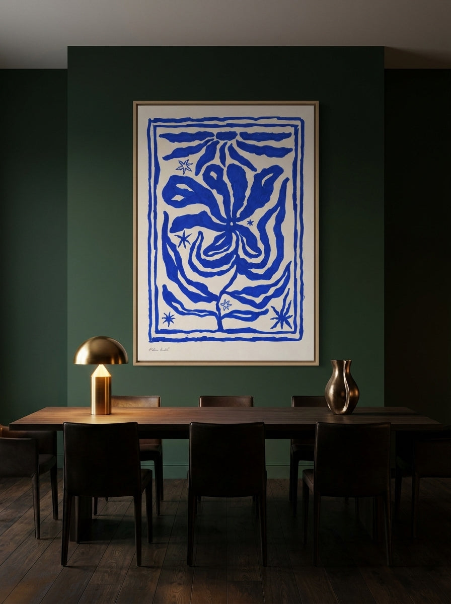 Oversized statement canvas wall art with a natural timber surround styled on the wall in a moody dining room