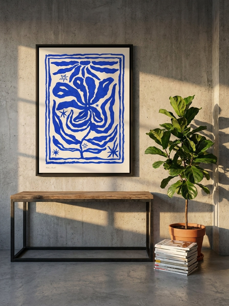 Canvas wall art with a black surround styled on the wall in an industrial loft living room