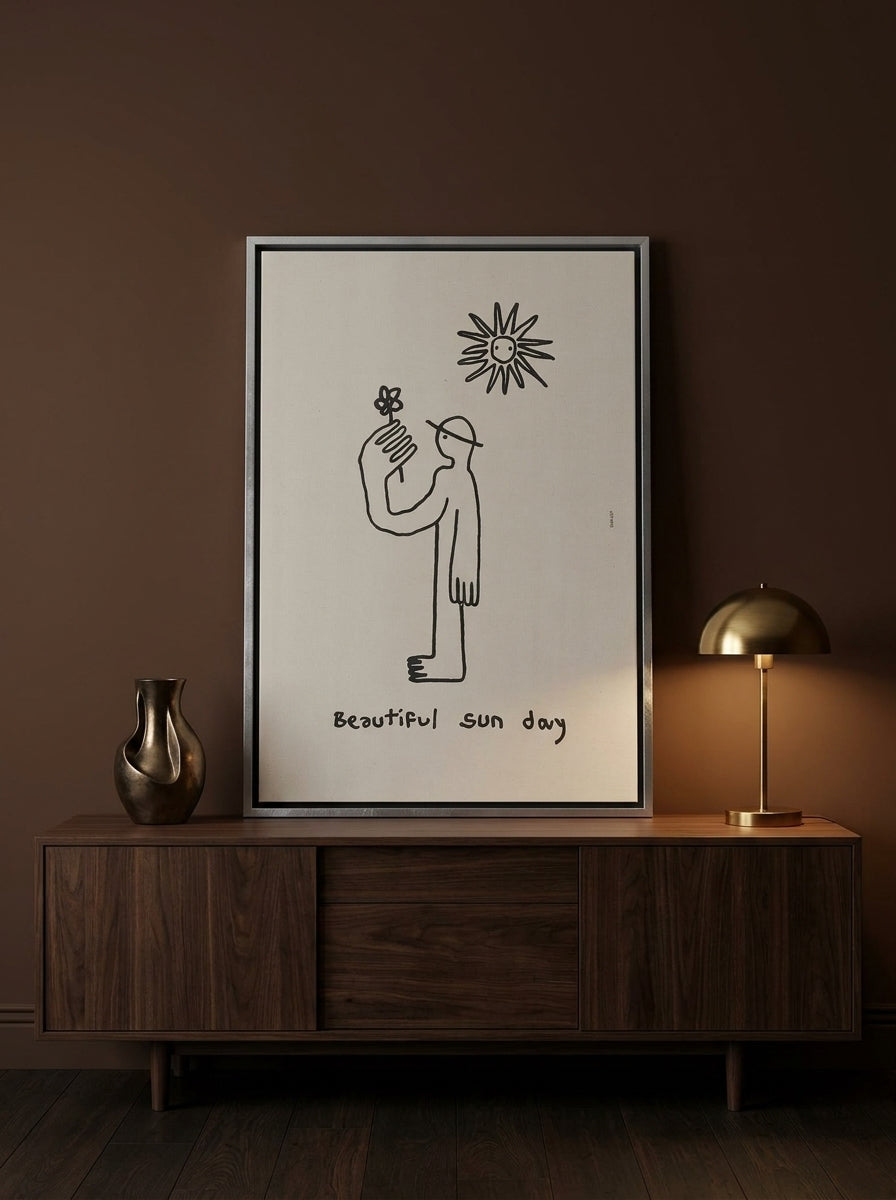 Canvas wall art with a silver leaf surround standing on a sideboard in a moody bedroom