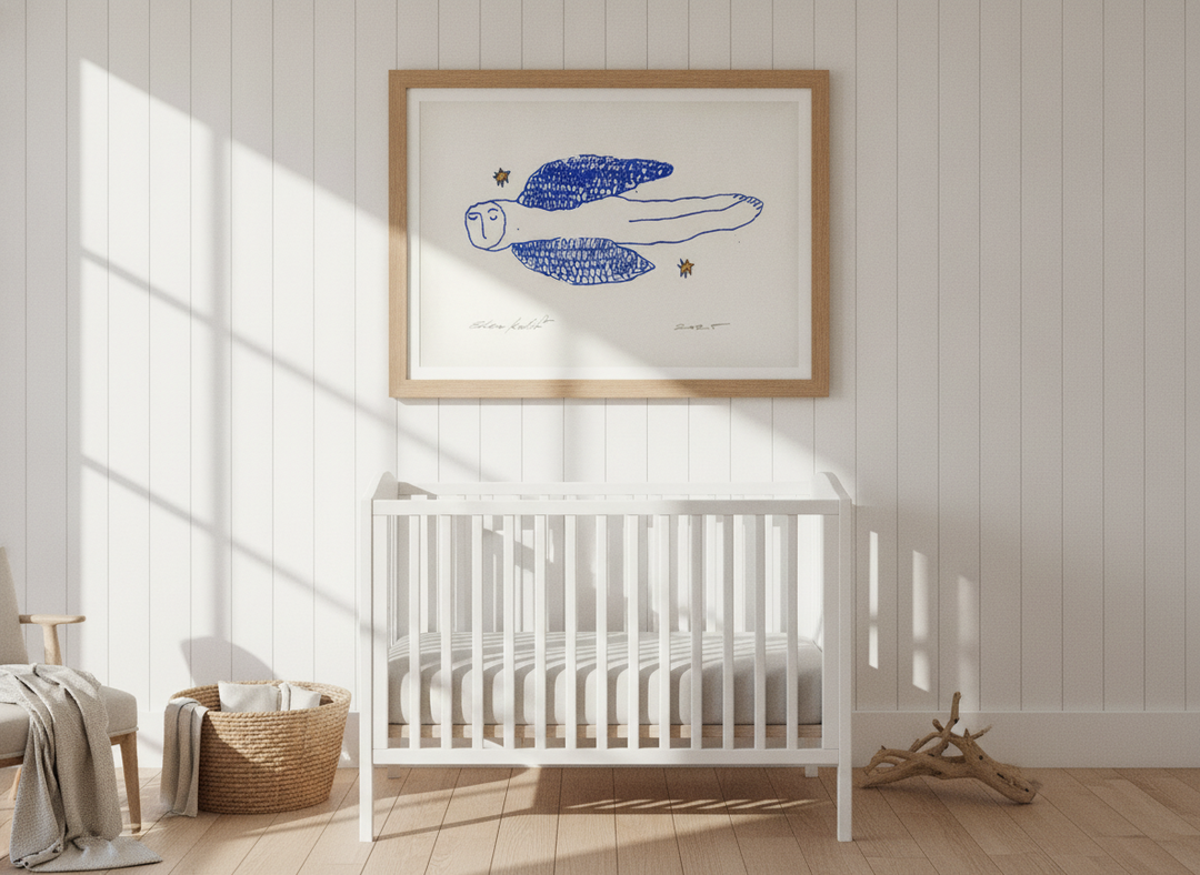 Modern wall art print styled on the wall in a coastal nursery