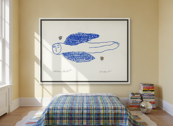 Oversized statement canvas wall art with a white surround styled on the wall in a colourful eclectic bedroom