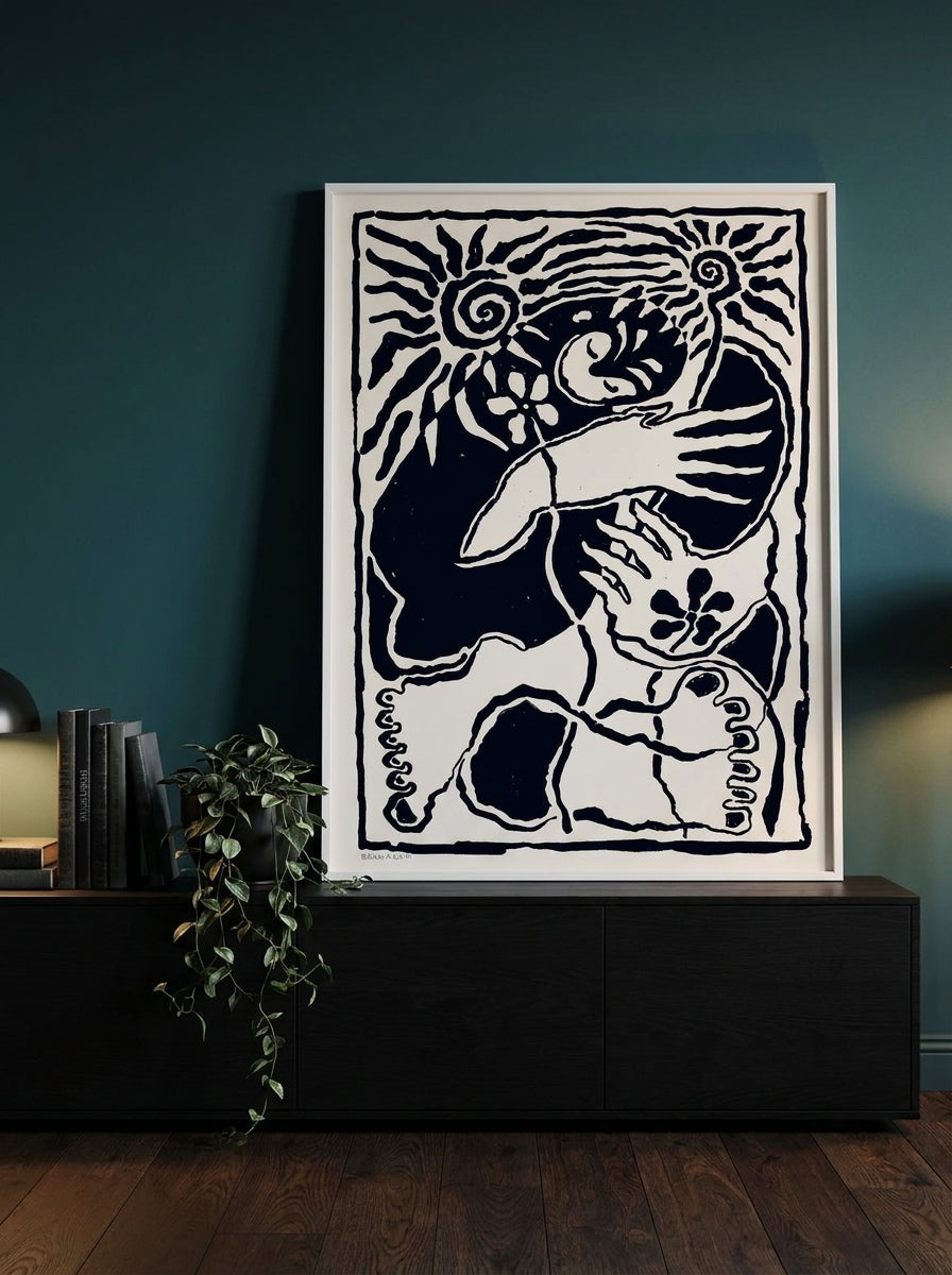 Modern wall art print standing on a console in a moody home office