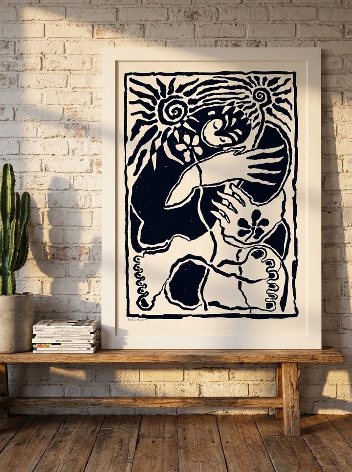 Modern wall art print standing on a bench in an industrial loft bedroom