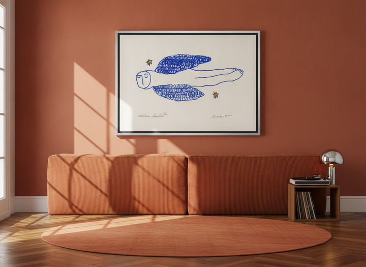 Canvas wall art with a silver leaf surround styled on the wall in a retro 70s bedroom