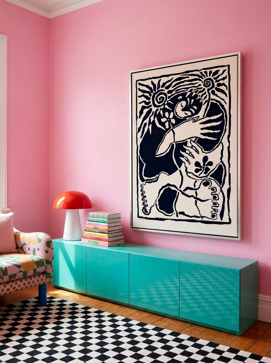 Oversized statement canvas wall art with a silver leaf surround styled on the wall in a colourful eclectic living room