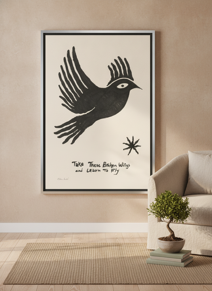 Canvas wall art with a silver leaf surround leaning against the wall in a warm Japandi home office
