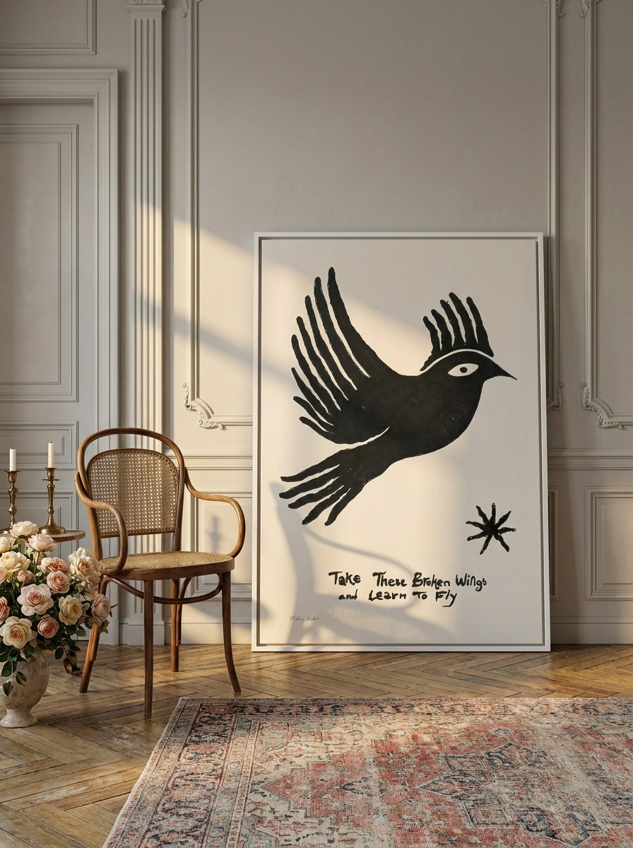 Oversized statement canvas wall art with a white surround leaning against the wall in a Parisian living room