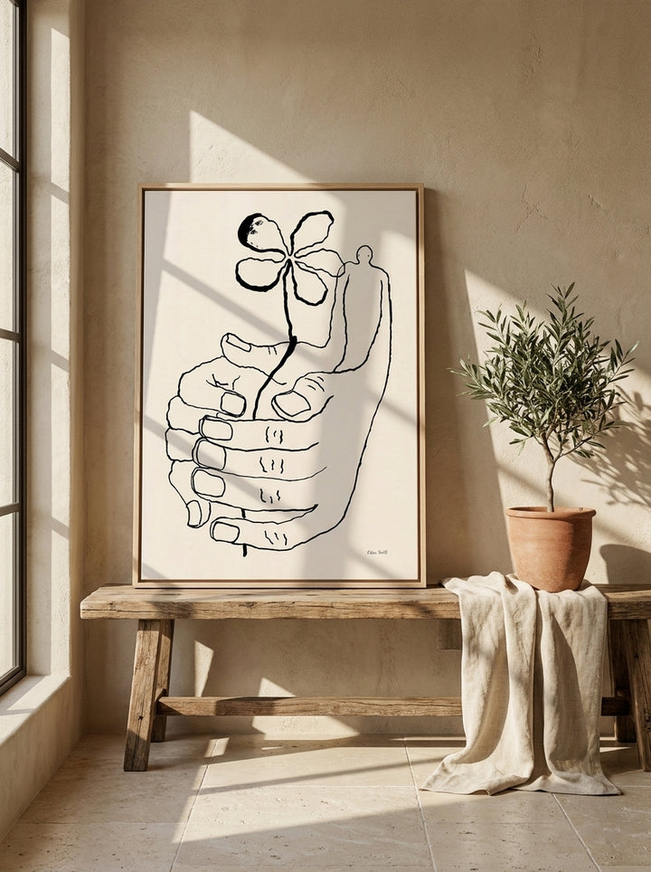 Canvas wall art with a natural timber surround standing on a bench in a Mediterranean bathroom
