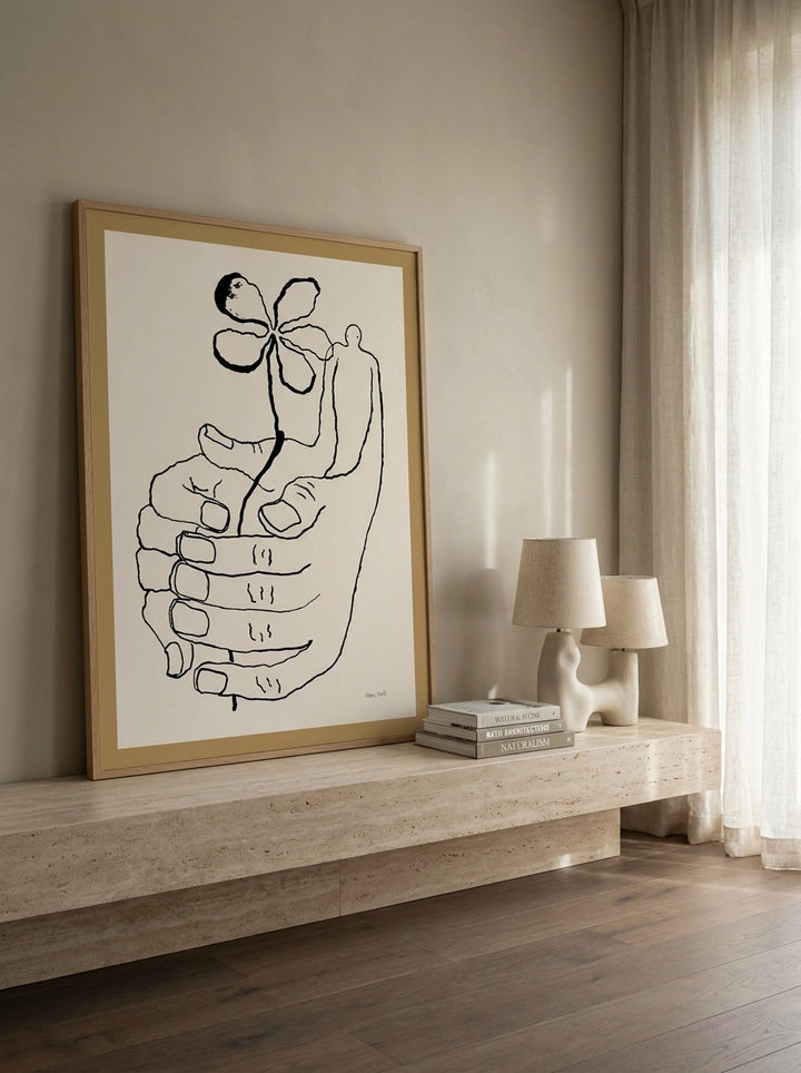 Modern wall art print standing on a console in a luxe bathroom