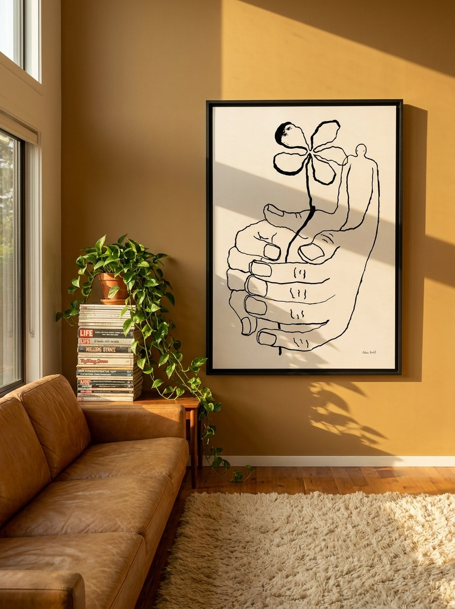 Oversized statement canvas wall art with a black surround styled on the wall in a retro 70s living room