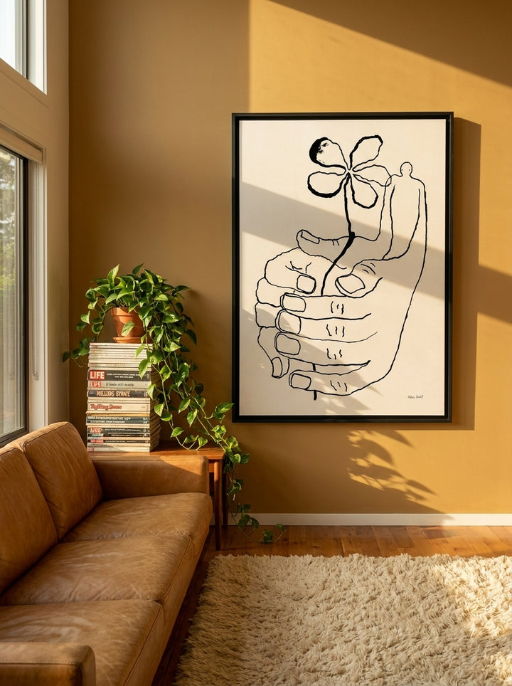 Oversized statement canvas wall art with a black surround styled on the wall in a retro 70s living room