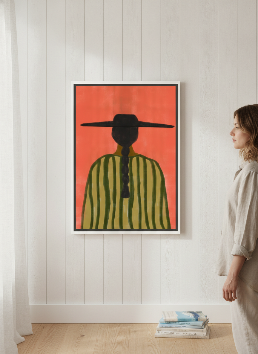 Person holding canvas wall art with a white surround in a coastal living room