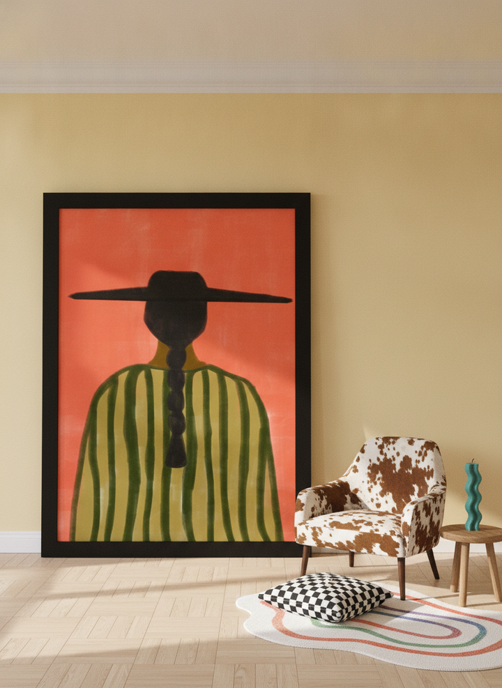 Oversized statement modern wall art print leaning against the wall in a colourful eclectic dining room