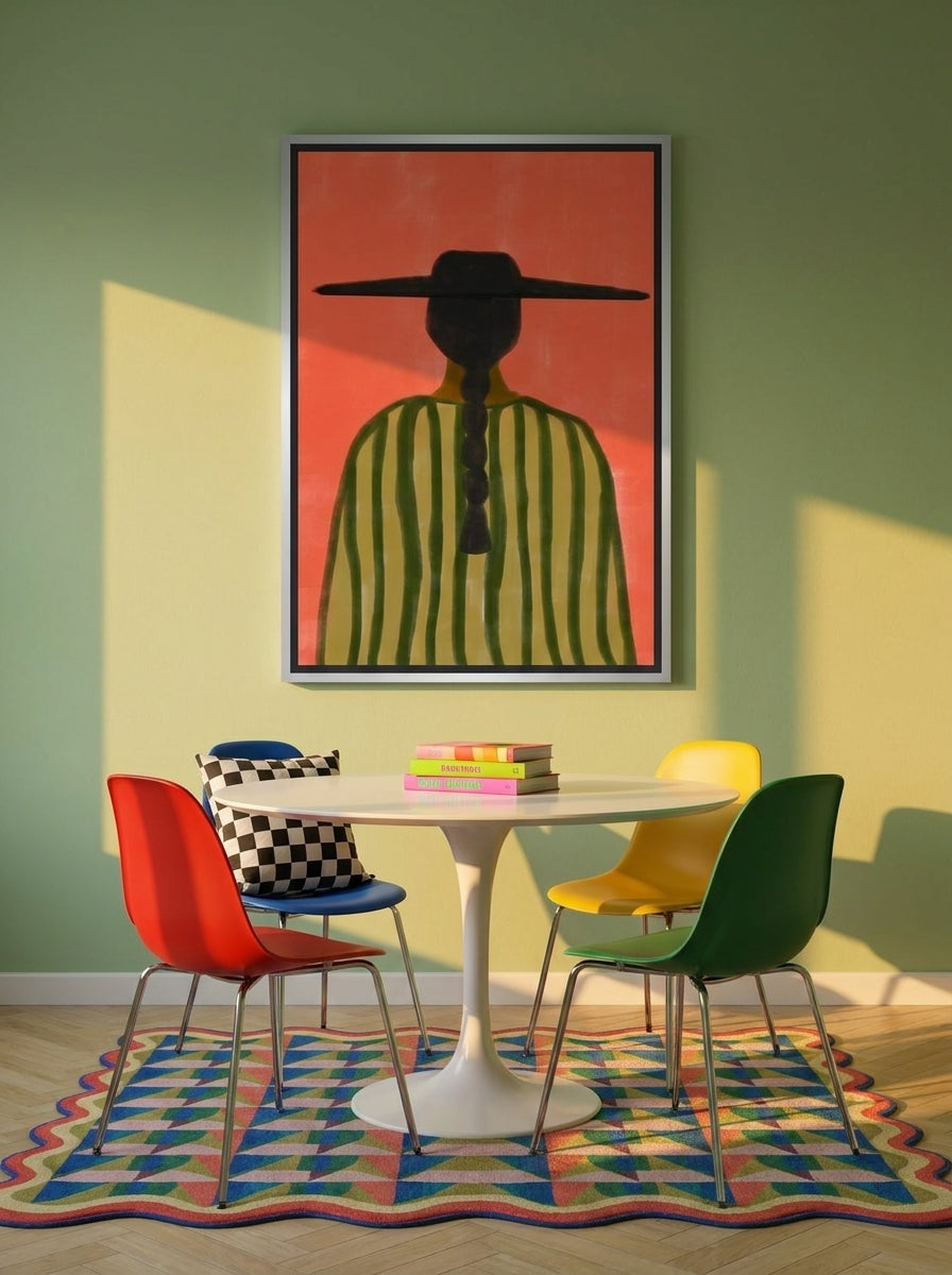 Canvas wall art with a silver leaf surround styled on the wall in a colourful eclectic dining room