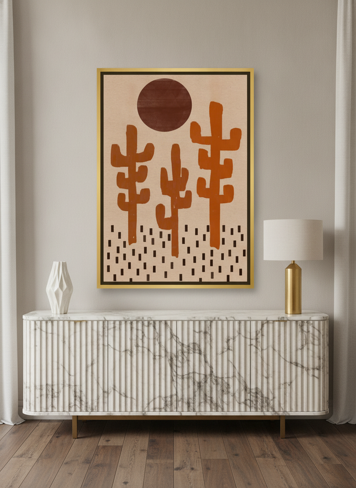 Canvas wall art with a gold leaf surround standing on a sideboard in a luxe home office