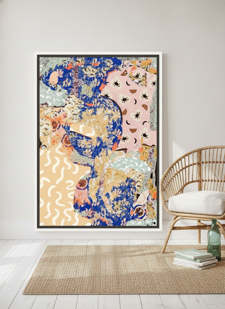 Canvas wall art with a white surround leaning against the wall in a coastal home office