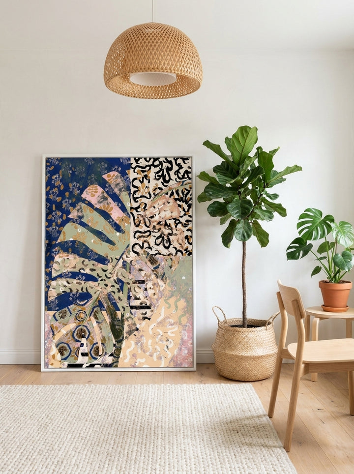 Canvas wall art with a white surround leaning against the wall in a bright Scandinavian home office