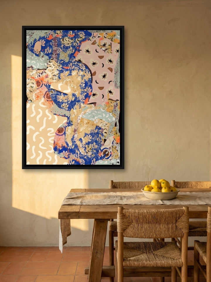 Canvas wall art with a black surround styled on the wall in a Mediterranean dining room