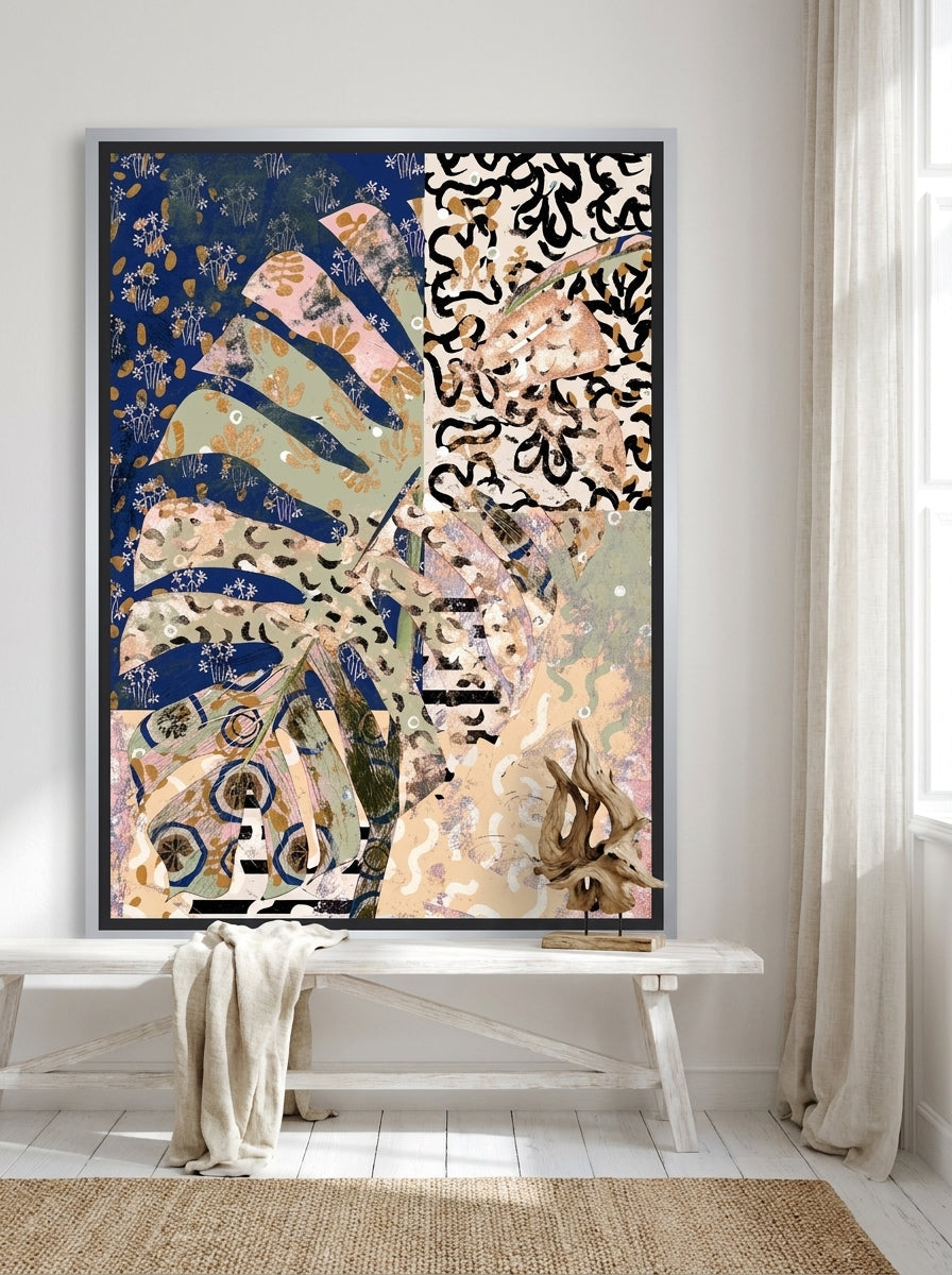 Canvas wall art with a silver leaf surround standing on a console in a coastal dining room