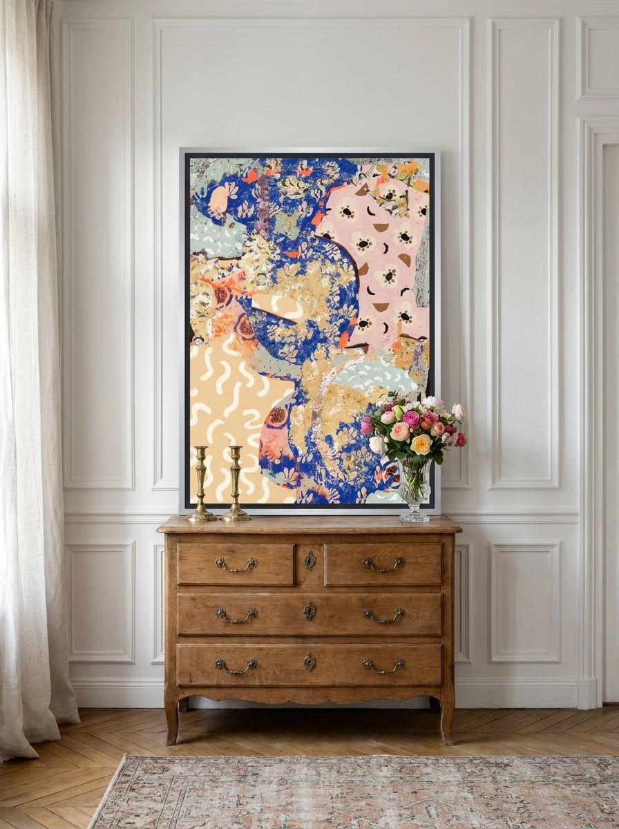 Canvas wall art with a silver leaf surround standing on a sideboard in a Parisian bedroom
