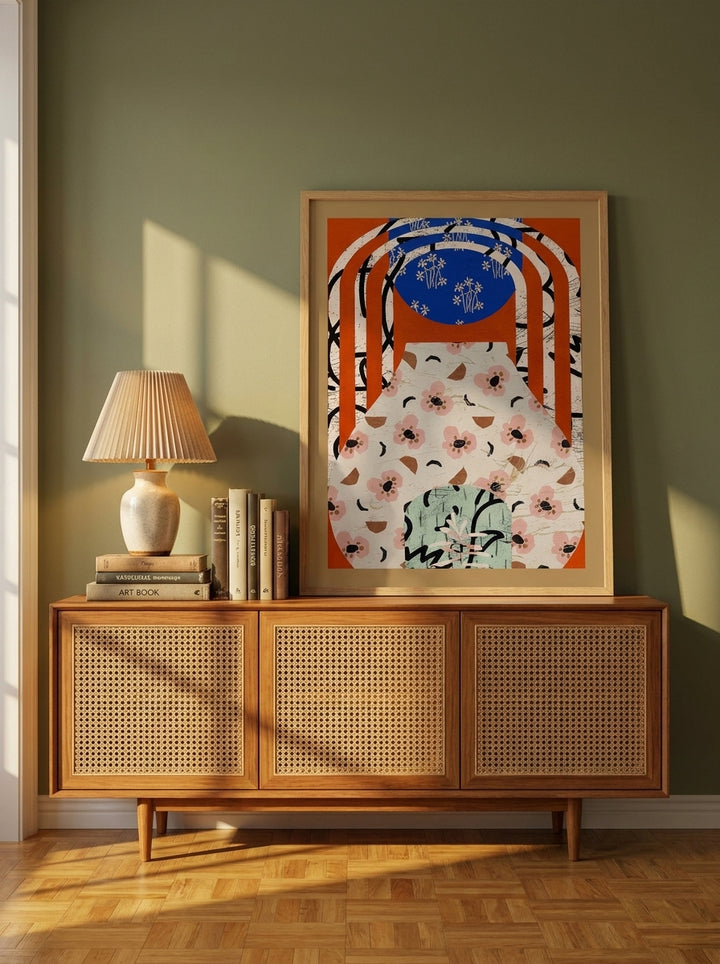 Modern wall art print standing on a sideboard in a mid-century bedroom