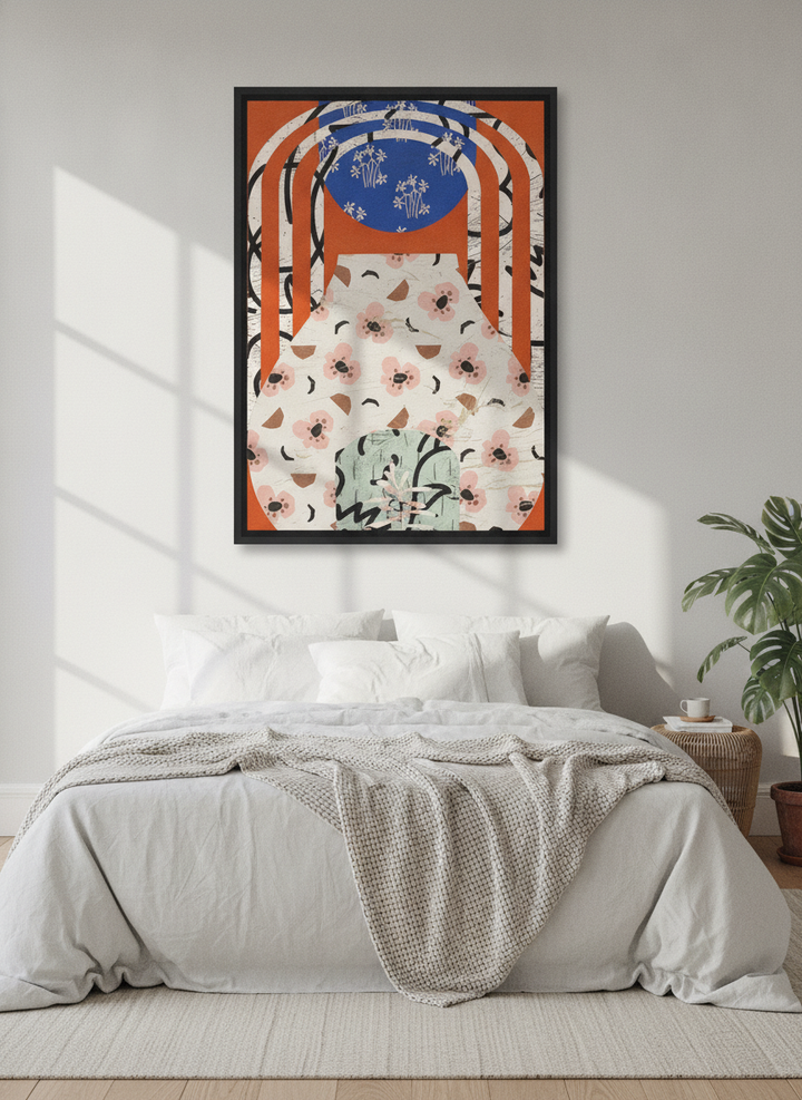 Canvas wall art with a black surround styled on the wall in a bright Scandinavian bedroom