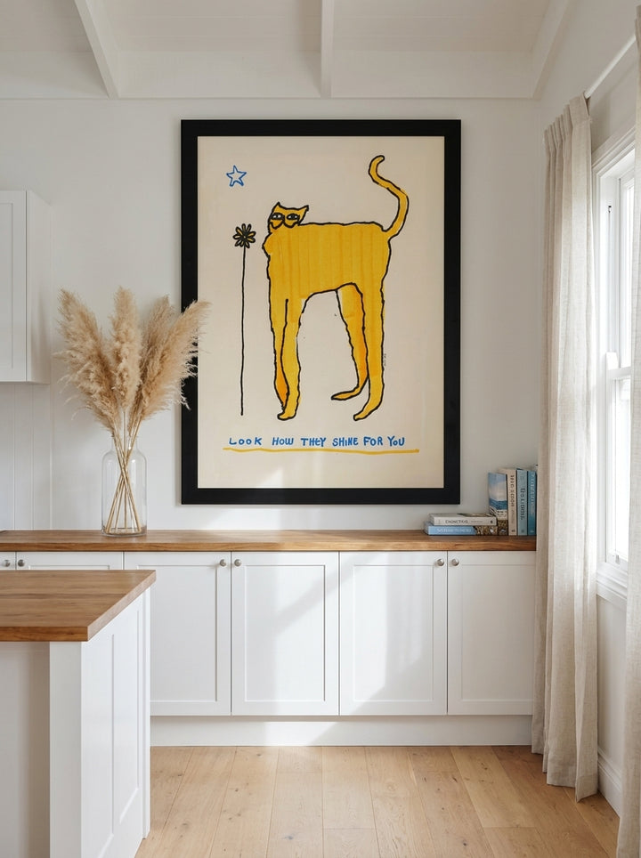 Oversized statement modern wall art print styled on the wall in a coastal kitchen