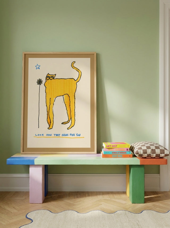 Modern wall art print standing on a side table in a colourful eclectic dining room