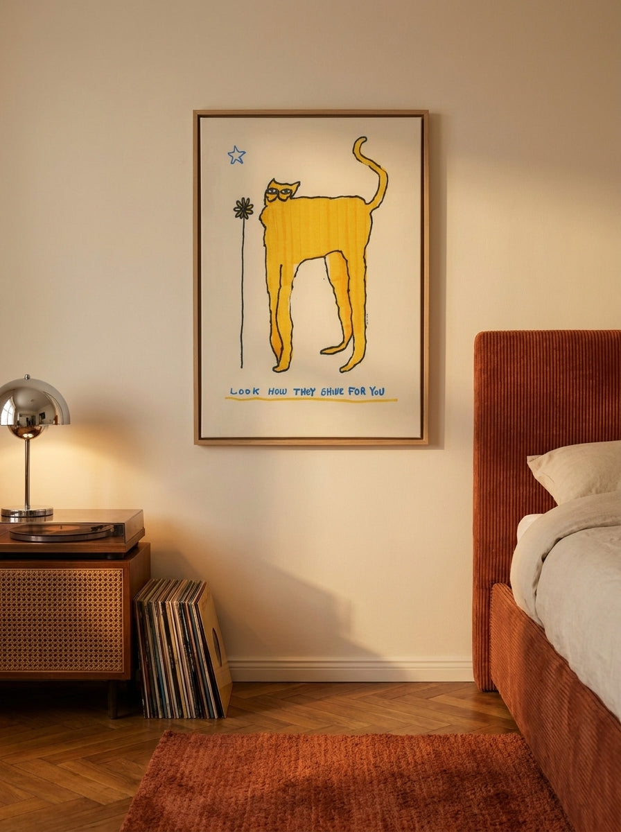 Canvas wall art with a natural timber surround styled on the wall in a retro 70s bedroom
