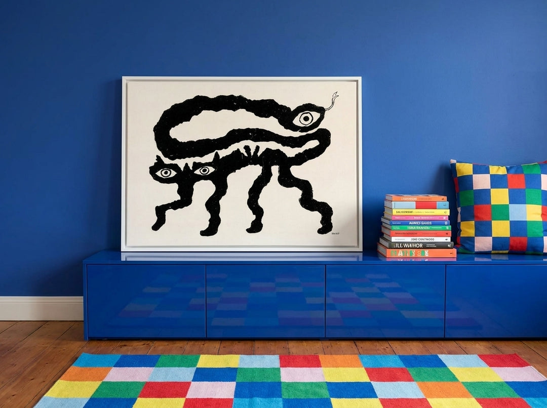 Canvas wall art with a white surround standing on a sideboard in a colourful eclectic bedroom