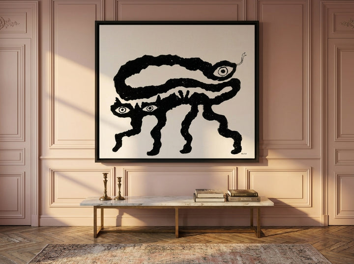 Oversized statement canvas wall art with a black surround styled on the wall in a Parisian living room
