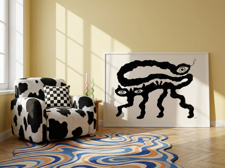 Modern wall art print leaning against the wall in a colourful eclectic living room