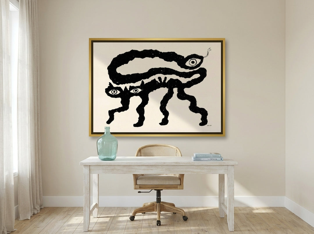 Oversized statement canvas wall art with a gold leaf surround styled on the wall in a coastal home office
