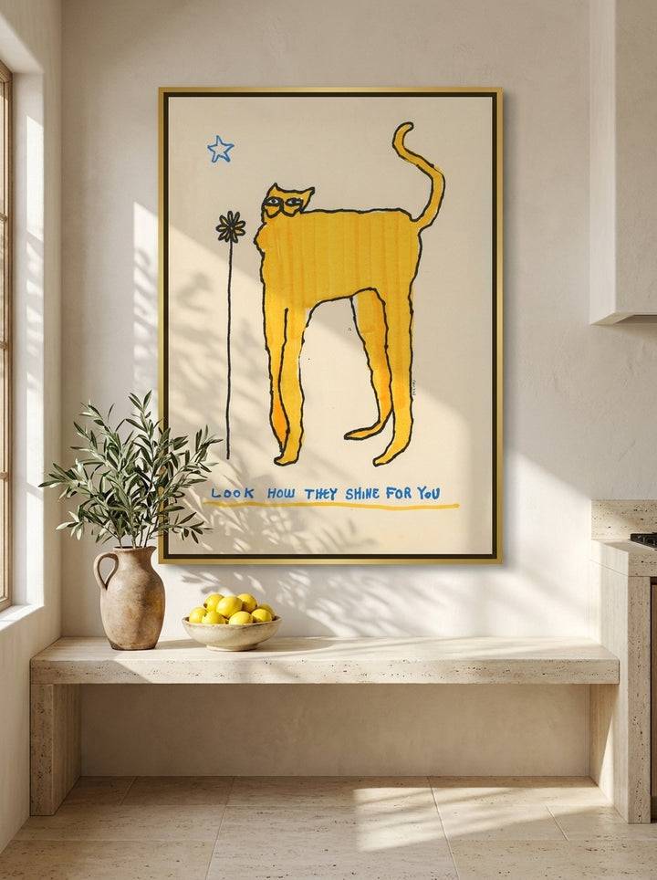 Oversized statement canvas wall art with a gold leaf surround styled on the wall in a Mediterranean kitchen