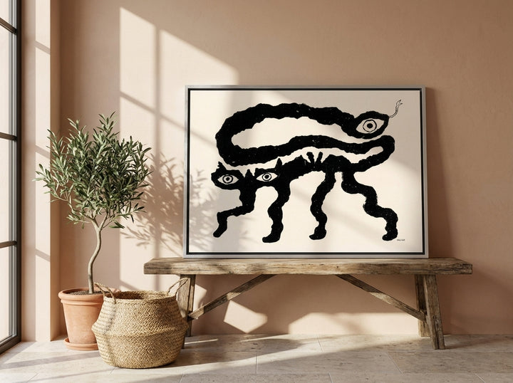 Canvas wall art with a silver leaf surround standing on a bench in a Mediterranean bedroom