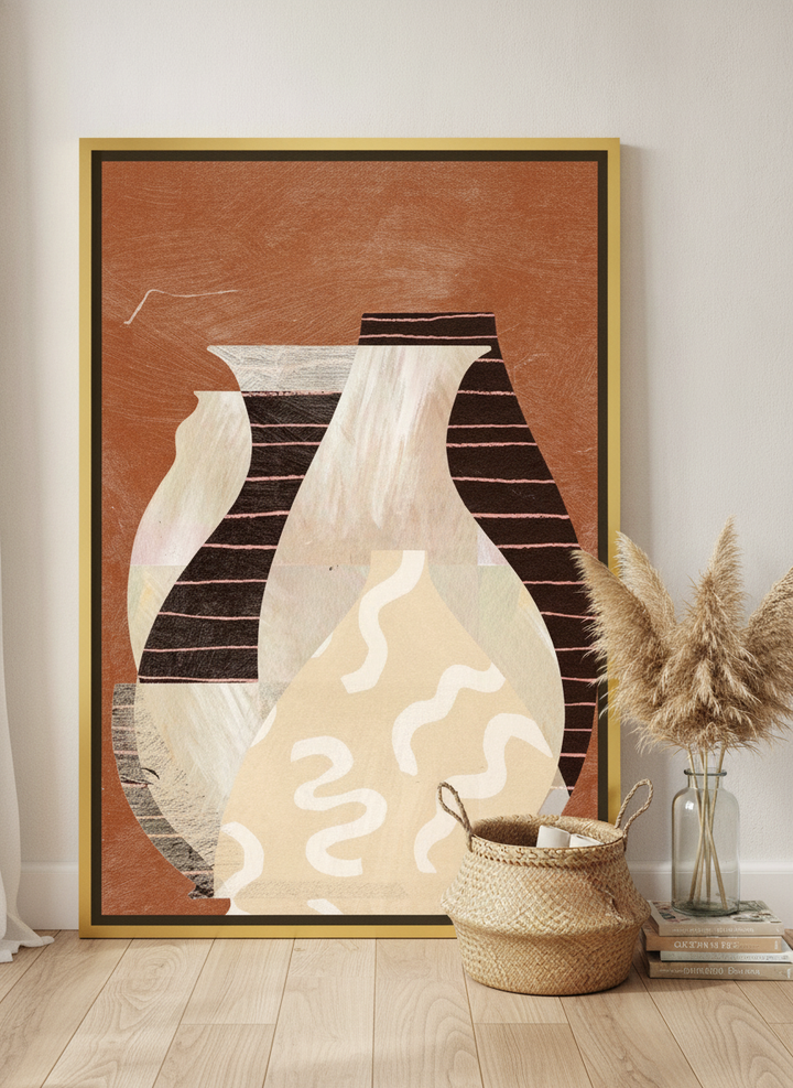 Oversized statement canvas wall art with a gold leaf surround leaning against the wall in a coastal home office