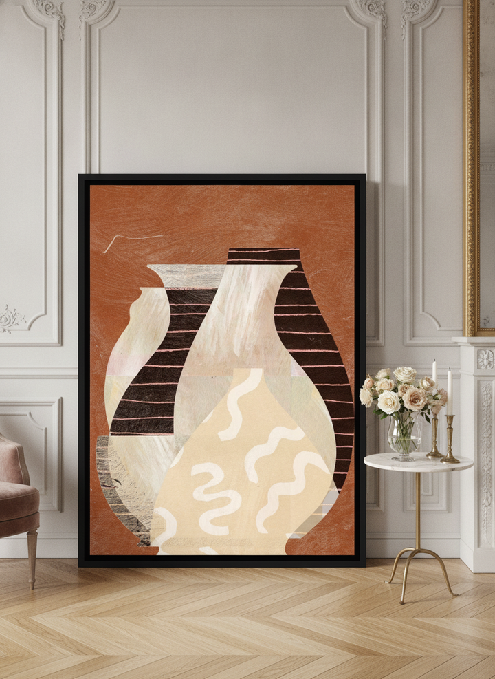 Oversized statement canvas wall art with a black surround leaning against the wall in a Parisian living room