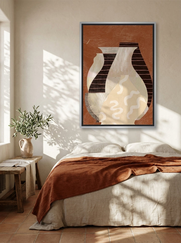 Canvas wall art with a silver leaf surround styled on the wall in a Mediterranean bedroom