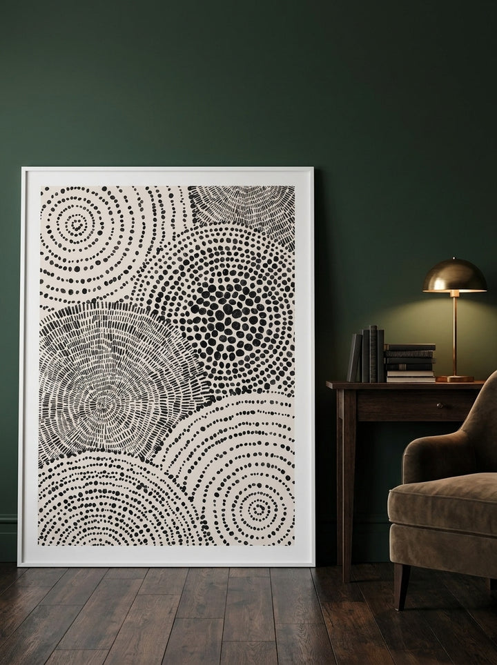 Oversized statement modern wall art print leaning against the wall in a moody living room