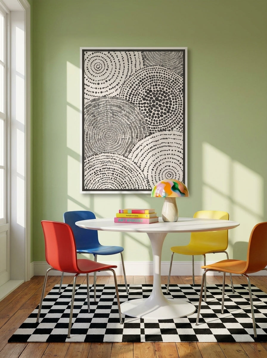 Canvas wall art with a white surround styled on the wall in a colourful eclectic dining room