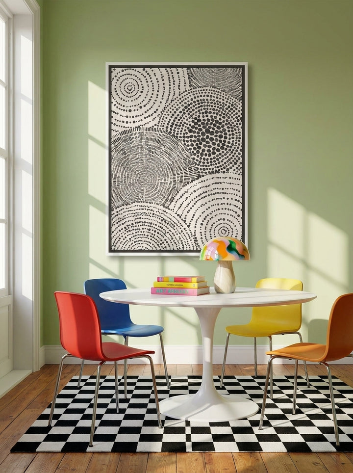 Canvas wall art with a white surround styled on the wall in a colourful eclectic dining room