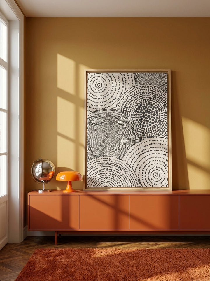 Canvas wall art with a natural timber surround standing on a sideboard in a retro 70s bedroom