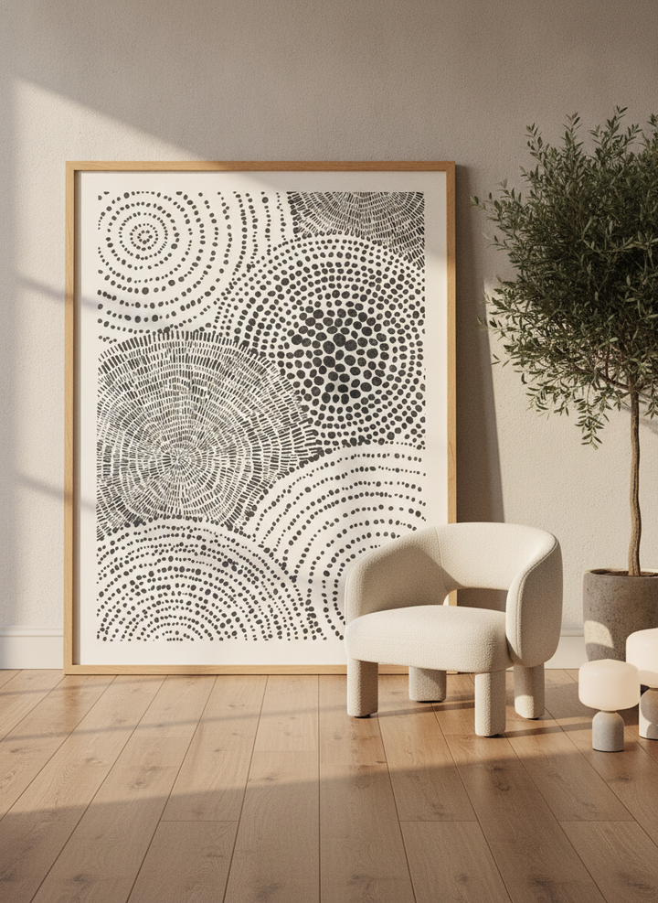 Oversized statement modern wall art print leaning against the wall in a luxe living room