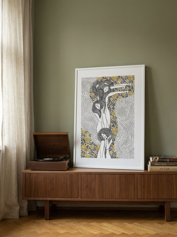 Modern wall art print standing on a sideboard in a mid-century bedroom