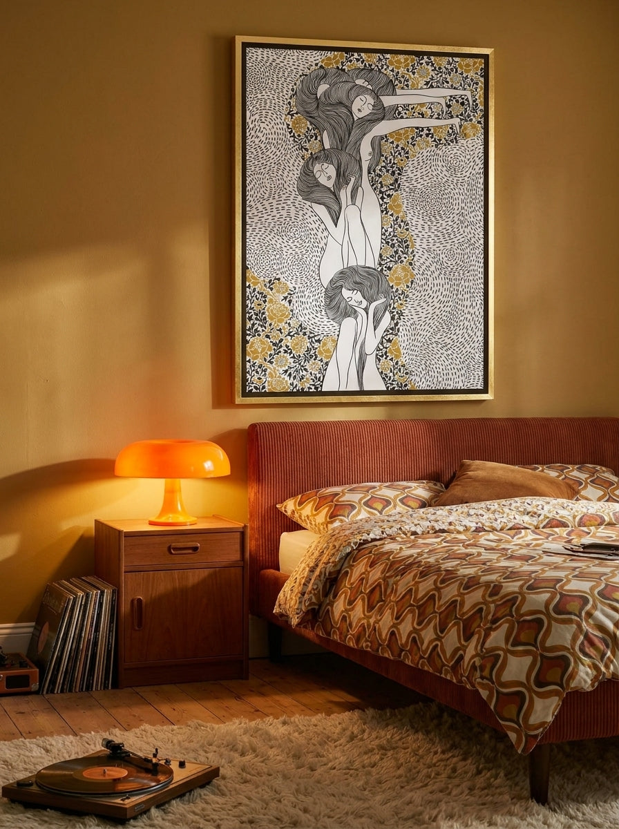 Canvas wall art with a gold leaf surround styled on the wall in a retro 70s bedroom