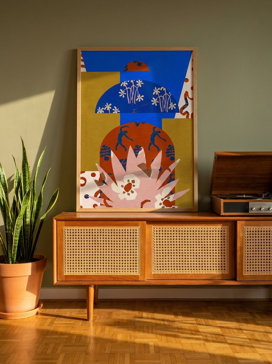 Modern wall art print standing on a sideboard in a mid-century home office