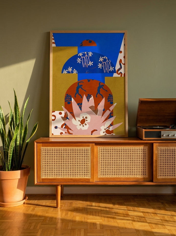 Modern wall art print standing on a sideboard in a mid-century home office