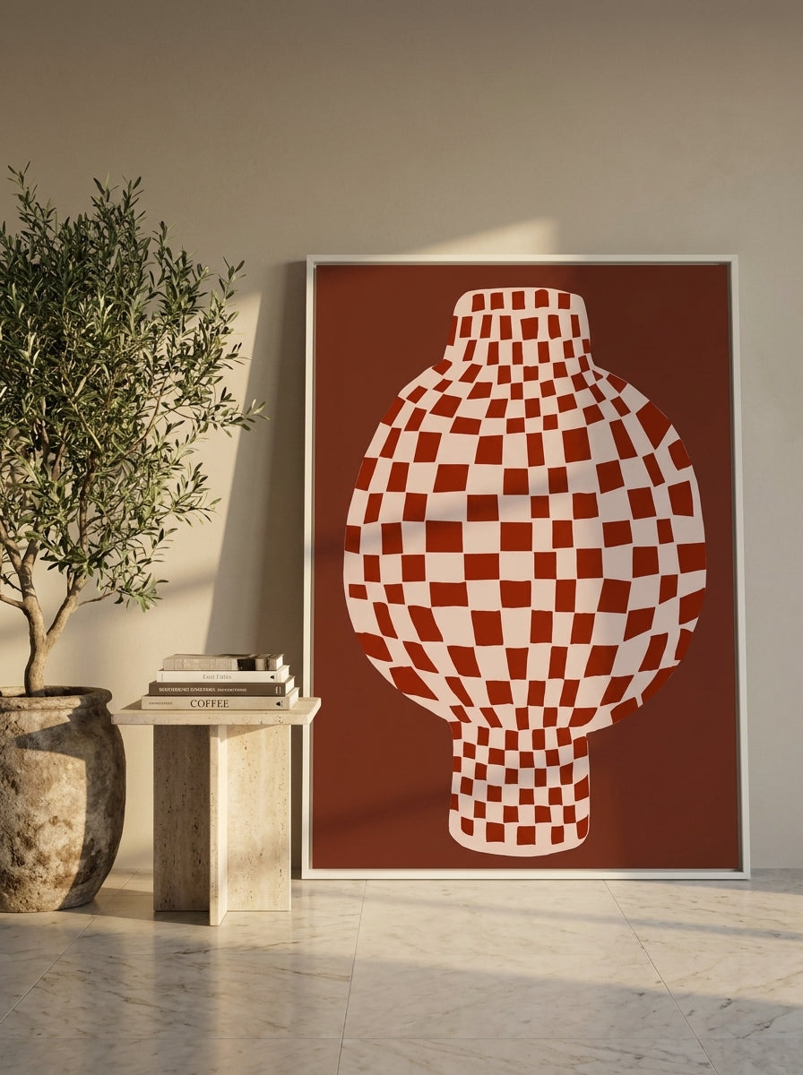 Oversized statement canvas wall art with a white surround leaning against the wall in a luxe dining room