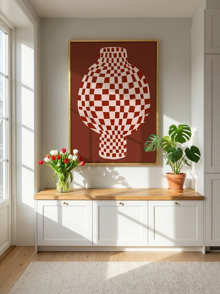 Canvas wall art with a gold leaf surround styled on the wall in a bright Scandinavian kitchen