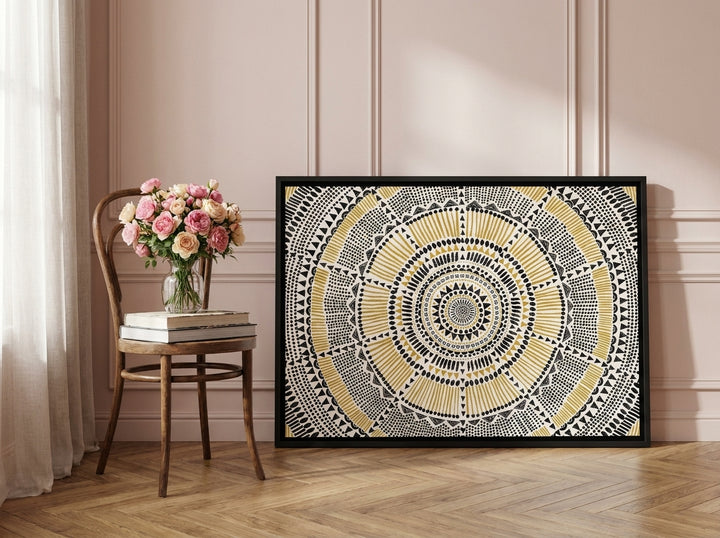 Canvas wall art with a black surround leaning against the wall in a Parisian home office